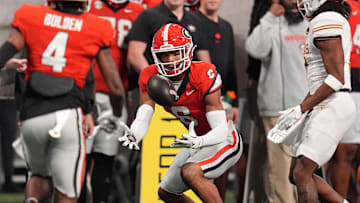 Georgia Bulldogs defensive back Daylen Everette (6) makes an interception against Texas Longhorns wide receiver Isaiah Bond (7) during the first half in the 2024 SEC Championship game at Mercedes-Benz Stadium.