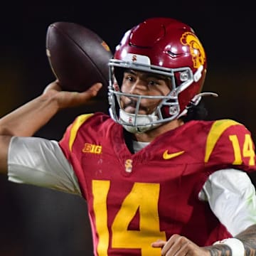 Nov 7, 2025; Los Angeles, California, USA; Southern California Trojans quarterback Jayden Maiava (14) throws against the Northwestern Wildcats during the second half at the Los Angeles Memorial Coliseum. Mandatory Credit: Gary A. Vasquez-Imagn Images