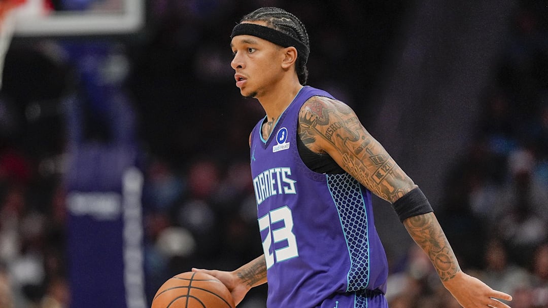 Nov 2, 2025; Charlotte, North Carolina, USA; Charlotte Hornets guard Tre Mann (23) handles the ball against the Utah Jazz during the first quarter at Spectrum Center. Mandatory Credit: Jim Dedmon-Imagn Images