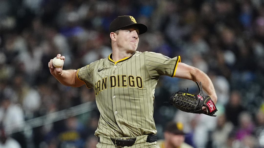 Sep 5, 2025; Denver, Colorado, USA; San Diego Padres starting pitcher Nick Pivetta (27) delivers a pitch in the fifth inning against the Colorado Rockies at Coors Field. Mandatory Credit: Ron Chenoy-Imagn Images
