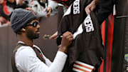 Cleveland Browns quarterback Shedeur Sanders signs autographs for fans before an NFL football game at Huntington Bank Field, Nov. 16, 2025, in Cleveland, Ohio.