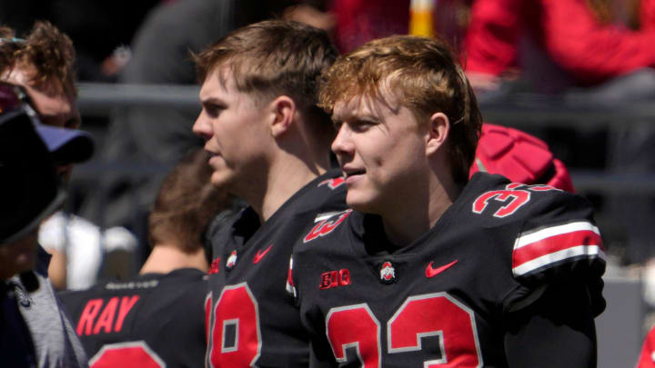 April 13, 2024; Columbus, Ohio, USA; 
Ohio State Buckeyes quarterbacks Will Howard (18) and Devin Brown (33) stand on the sideline during the second half of the LifeSports spring football game at Ohio Stadium on Saturday.