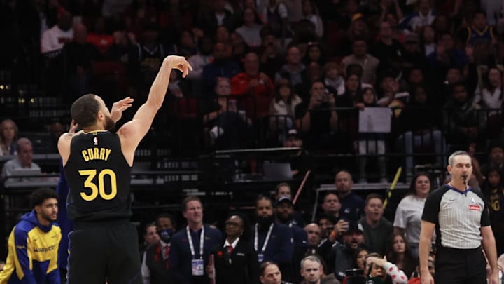 Feb 13, 2025; Houston, Texas, USA; Golden State Warriors guard Stephen Curry (30) makes a three point basket against the Houston Rockets in the second half at Toyota Center. Mandatory Credit: Thomas Shea-Imagn Images