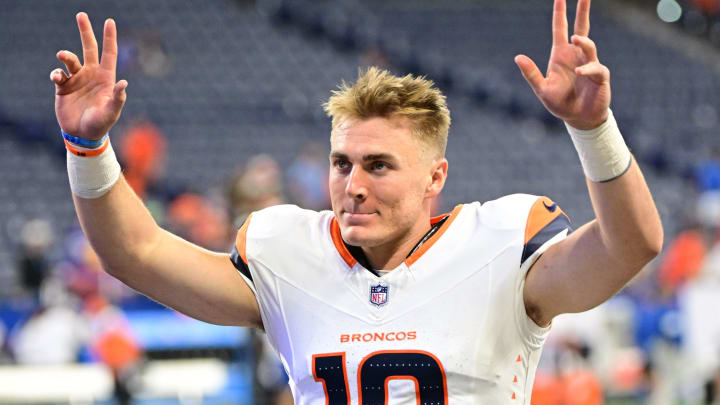 Aug 11, 2024; Indianapolis, Indiana, USA; Denver Broncos quarterback Bo Nix (10) waves to fans after the game against the Indianapolis Colts at Lucas Oil Stadium. 