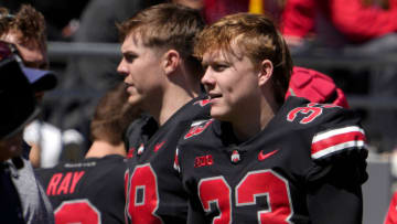 April 13, 2024; Columbus, Ohio, USA; 
Ohio State Buckeyes quarterbacks Will Howard (18) and Devin Brown (33) stand on the sideline during the second half of the LifeSports spring football game at Ohio Stadium on Saturday.