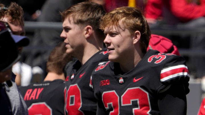 April 13, 2024; Columbus, Ohio, USA; 
Ohio State Buckeyes quarterbacks Will Howard (18) and Devin Brown (33) stand on the sideline during the second half of the LifeSports spring football game at Ohio Stadium on Saturday.