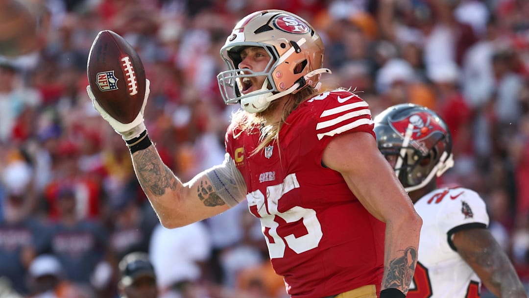 Nov 10, 2024; Tampa, Florida, USA; San Francisco 49ers tight end George Kittle (85) celebrates after scoring a touchdown against the Tampa Bay Buccaneers in the fourth quarter at Raymond James Stadium. Mandatory Credit: Nathan Ray Seebeck-Imagn Images