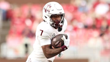 Oct 18, 2025; Fayetteville, Arkansas, USA; Texas A&M Aggies wide receiver KC Concepcion (7) runs after a catch during the first quarter against the Arkansas Razorbacks at Donald W. Reynolds Razorback Stadium. Mandatory Credit: Nelson Chenault-Imagn Images