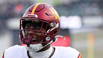 Washington Commanders wide receiver Terry McLaurin reacts after a play with wide receiver Olamide Zaccheaus.