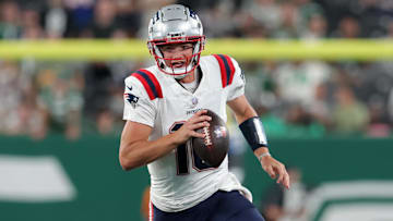 Sep 19, 2024; East Rutherford, New Jersey, USA; New England Patriots quarterback Drake Maye (10) runs with the ball against the New York Jets during the fourth quarter at MetLife Stadium. Mandatory Credit: Brad Penner-Imagn Images