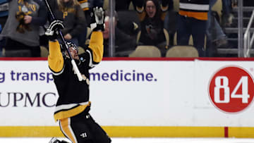 Apr 11, 2024; Pittsburgh, Pennsylvania, USA; Pittsburgh Penguins defenseman Erik Karlsson (65) reacts after scoring the game winning goal against the Detroit Red Wings in overtime at PPG Paints Arena. Pittsburgh won 6-5 in overtime. Mandatory Credit: Charles LeClaire-Imagn Images