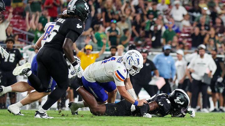 USF defensive back Ira Singleton (10) recovers a fumble from Boise State quarterback Maddux Madsen. It was one of three fumble recoveries for the Bulls.