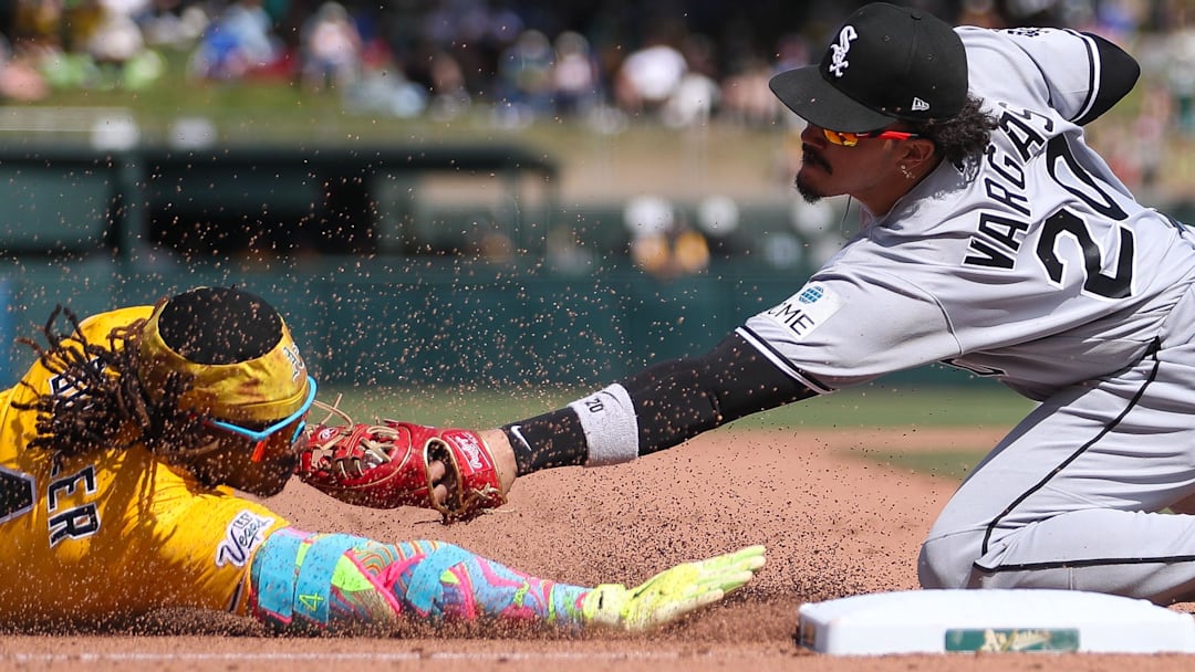 Apr 18, 2026; West Sacramento, California, USA; Athletics center fielder Lawrence Butler (4) is tagged out by Chicago White Sox third baseman Miguel Vargas (20) as he tires to extend his double into a triple during the eighth inning at Sutter Health Park. Mandatory Credit: Scott Marshall-Imagn Images