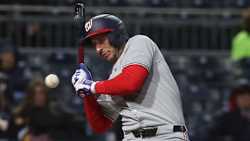 Apr 15, 2025; Pittsburgh, Pennsylvania, USA;  Washington Nationals third baseman Paul DeJong (14) reacts after being hit in the face by a Pittsburgh Pirates pitch during the sixth inning at PNC Park.