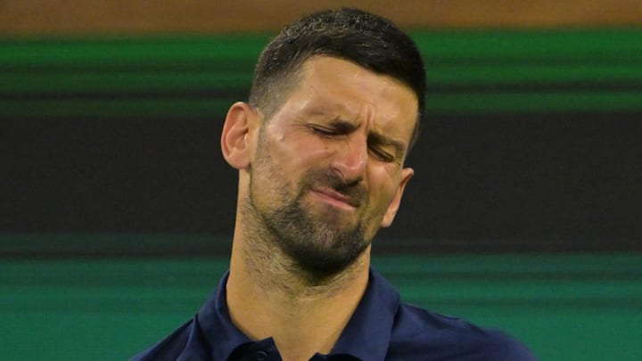 Novak Djokovic reacts after missing a shot