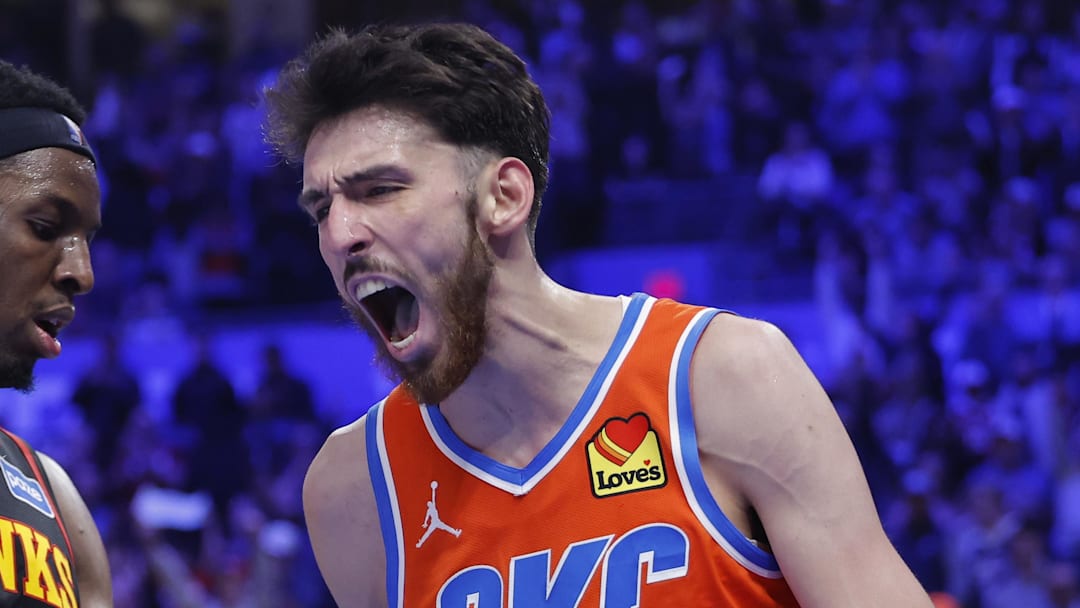 Dec 29, 2025; Oklahoma City, Oklahoma, USA; Oklahoma City Thunder center Chet Holmgren (7) screams next to Atlanta Hawks forward Onyeka Okongwu (17) after dunking against the Atlanta Hawks during the second half at Paycom Center. Mandatory Credit: Alonzo Adams-Imagn Images