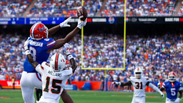 Florida Gators tight end Arlis Boardingham (8) can’t hold onto a pass while being defended by Miami Hurricanes defensive back Markeith Williams (15) during the season opener at Ben Hill Griffin Stadium in Gainesville, FL on Saturday, August 31, 2024 against the University of Miami Hurricanes in the first half. [Doug Engle/Gainesville Sun]