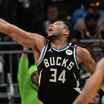 Apr 27, 2025; Milwaukee, Wisconsin, USA; Indiana Pacers guard T.J. McConnell (9) looks for a shot against Milwaukee Bucks forward Giannis Antetokounmpo (34) in the third quarter during game four of first round for the 2024 NBA Playoffs at Fiserv Forum. Mandatory Credit: Benny Sieu-Imagn Images