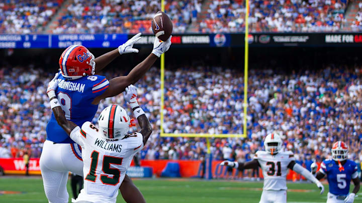 Florida Gators tight end Arlis Boardingham (8) can’t hold onto a pass while being defended by Miami Hurricanes defensive back Markeith Williams (15) during the season opener at Ben Hill Griffin Stadium in Gainesville, FL on Saturday, August 31, 2024 against the University of Miami Hurricanes in the first half. [Doug Engle/Gainesville Sun]