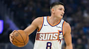 Nov 4, 2025; San Francisco, California, USA; Phoenix Suns guard Grayson Allen (8) dribbles against Golden State Warriors guard Stephen Curry (30) in the first quarter at Chase Center. Mandatory Credit: Eakin Howard-Imagn Images