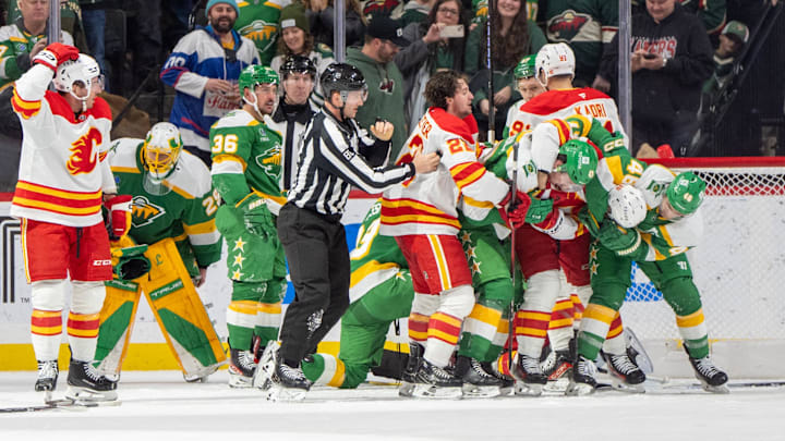 Jan 25, 2025; Saint Paul, Minnesota, USA; The Minnesota Wild and Calgary Flames fight resulting in three penalties for each side in the second period at Xcel Energy Center. Mandatory Credit: Matt Blewett-Imagn Images Jan 25, 2025; Saint Paul, Minnesota, USA; The Minnesota Wild and Calgary Flames fight resulting in three penalties for each side in the second period at Xcel Energy Center. Mandatory Credit: Matt Blewett-Imagn Images
