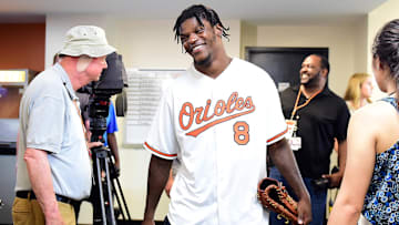 Jul 17, 2019; Baltimore, MD, USA; Baltimore Ravens quarterback Lamar Jackson (8) is interviewed before a game between the Washington Nationals and Baltimore Orioles at Oriole Park at Camden Yards. Jackson was scheduled to throw out the first pitch. Mandatory Credit: Evan Habeeb-Imagn Images