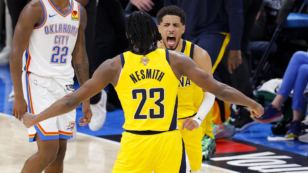 Jun 5, 2025; Oklahoma City, Oklahoma, USA; Indiana Pacers guard Tyrese Haliburton (0) and forward Aaron Nesmith (23) celebrate after Haliburton makes the game winning shot as Oklahoma City Thunder guard Cason Wallace (22) looks on during the fourth quarter during game one of the 2025 NBA Finals at Paycom Center. Mandatory Credit: Alonzo Adams-Imagn Images