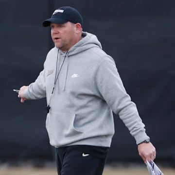 Purdue Boilermakers head coach Barry Odom walks 