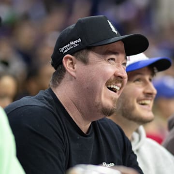 Nov 2, 2024; Philadelphia, Pennsylvania, USA; Comedian Shane Gillis (M) looks on during the second quarter of action between the Philadelphia 76ers and the Memphis Grizzlies at Wells Fargo Center. Mandatory Credit: Bill Streicher-Imagn Images