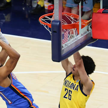 Jun 19, 2025; Indianapolis, Indiana, USA; Oklahoma City Thunder guard Aaron Wiggins (21) shoots the ball defended by Indiana Pacers guard Ben Sheppard (26) in the fourth quarter during game six of the 2025 NBA Finals at Gainbridge Fieldhouse. Mandatory Credit: Trevor Ruszkowski-Imagn Images