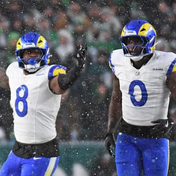 Jan 19, 2025; Philadelphia, Pennsylvania, USA; Los Angeles Rams linebacker Jared Verse (8) and linebacker Byron Young (0) celebrate a sack against the Philadelphia Eagles in a 2025 NFC divisional round game at Lincoln Financial Field. Mandatory Credit: Eric Hartline-Imagn Images
