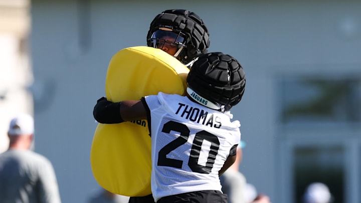 Jul 24, 2024; Jacksonville, FL, USA; Jacksonville Jaguars safety Daniel Thomas (20) and cornerback De’Antre Prince (24) participates in training camp at Miller Electric Center. Mandatory Credit: Nathan Ray Seebeck-Imagn Images