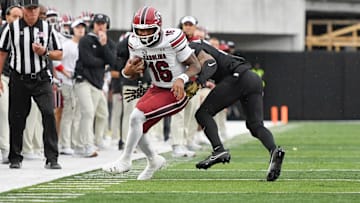 Nov 9, 2024; Nashville, Tennessee, USA;  Vanderbilt Commodores linebacker Randon Fontenette (2) tackles South Carolina Gamecocks quarterback LaNorris Sellers (16) during the first half at FirstBank Stadium. Mandatory Credit: Steve Roberts-Imagn Images