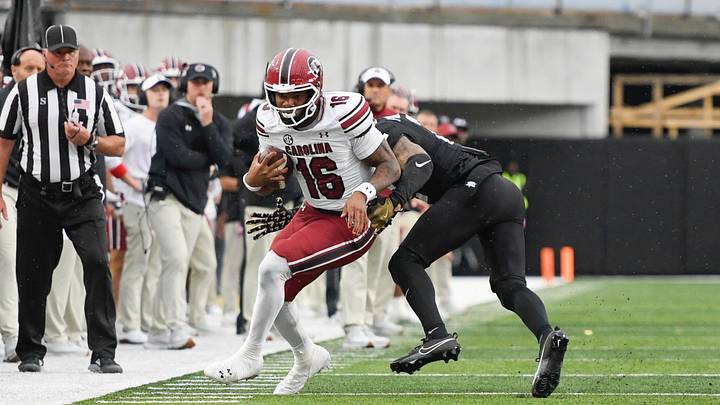 Nov 9, 2024; Nashville, Tennessee, USA;  Vanderbilt Commodores linebacker Randon Fontenette (2) tackles South Carolina Gamecocks quarterback LaNorris Sellers (16) during the first half at FirstBank Stadium. Mandatory Credit: Steve Roberts-Imagn Images
