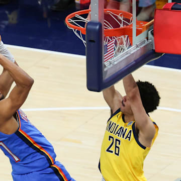 Jun 19, 2025; Indianapolis, Indiana, USA; Oklahoma City Thunder guard Aaron Wiggins (21) shoots the ball defended by Indiana Pacers guard Ben Sheppard (26) in the fourth quarter during game six of the 2025 NBA Finals at Gainbridge Fieldhouse.