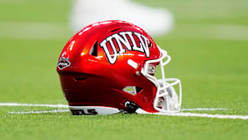 A UNLV Rebels helmet sits on the field during the second half of a game between the UNLV Rebels and the Hawaii Warriors at Allegiant Stadium on September 30, 2023 in Las Vegas, Nevada. Rebels defeat the Warriors 44-20.