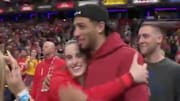 Indiana Fever's Caitlin Clark hugs Indiana Pacers' Tyrese Haliburton after a win.