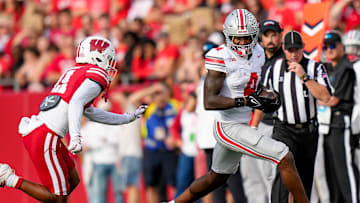 Ohio State Buckeyes wide receiver Jeremiah Smith (4) runs the ball during the game against the Wisconsin Badgers at Camp Randall Stadium on Saturday, Oct. 18, 2025 in Madison, Wisconsin.