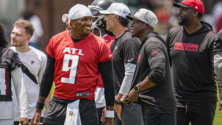Jun 11, 2025; Atlanta, GA, USA; Atlanta Falcons quarterback Michael Penix Jr. (9) and head coach Raheem Morris on the field during Minicamp at Children's Healthcare of Atlanta Training Ground. Mandatory Credit: Dale Zanine-Imagn Images