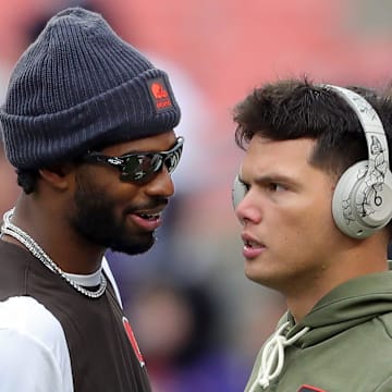 Browns quarterbacks Shedeur Sanders and Dillon Gabriel talk before a game, Nov. 16, 2025.