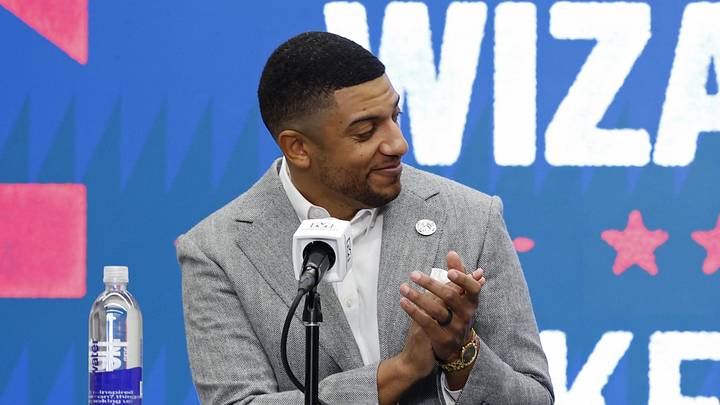 Jan 9, 2026; Washington, District of Columbia, USA; Washington Wizards general manager Will Dawkins (L) introduces newly acquired Wizards guard Trae Young (R) at a press conference prior to the Wizards' game against the New Orleans Pelicans at Capital One Arena. Mandatory Credit: Geoff Burke-Imagn Images