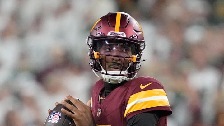 Washington Commanders quarterback Jayden Daniels passes in the fourth quarter against the Green Bay Packers.