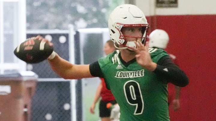 Louisville’s Tyler Shough, the starting quarterback, got ready to throw the ball during one of the plays at the first practice of the year.