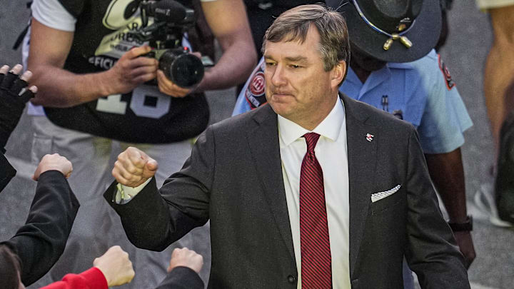 Nov 15, 2025; Athens, Georgia, USA; Georgia Bulldogs head coach Kirby Smart walks through the fans during the Dawgwalk prior to the game against the Texas Longhorns at Sanford Stadium. Mandatory Credit: Dale Zanine-Imagn Images