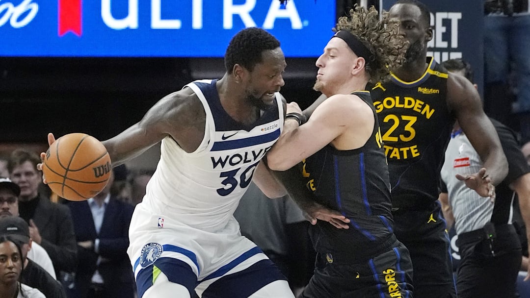 May 6, 2025; Minneapolis, Minnesota, USA; Golden State Warriors guard Brandin Podziemski (2) defends against Minnesota Timberwolves forward Julius Randle (30) in the third quarter during game one of the second round for the 2025 NBA Playoffs at Target Center. Mandatory Credit: Bruce Kluckhohn-Imagn Images