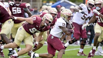 Apr 20, 2024; Tallahassee, Florida, USA; Florida State Seminoles running back Jaylin Lucas (13) runs with the ball during the Spring Showcase at Doak S. Campbell Stadium. Mandatory Credit: Melina Myers-Imagn Images