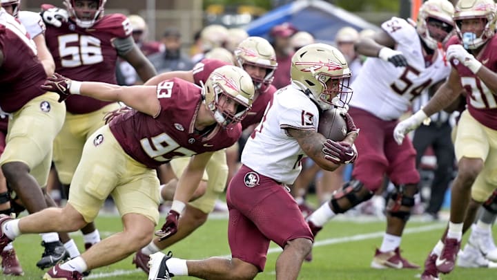 Apr 20, 2024; Tallahassee, Florida, USA; Florida State Seminoles running back Jaylin Lucas (13) runs with the ball during the Spring Showcase at Doak S. Campbell Stadium. Mandatory Credit: Melina Myers-USA TODAY Sports
