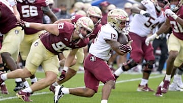 Apr 20, 2024; Tallahassee, Florida, USA; Florida State Seminoles running back Jaylin Lucas (13) runs with the ball during the Spring Showcase at Doak S. Campbell Stadium. Mandatory Credit: Melina Myers-Imagn Images