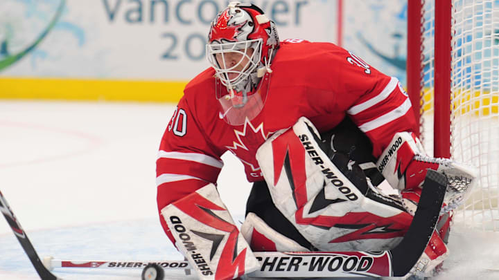 Canada goaltender Martin Brodeur (30) makes a save against USA during the 2010 Vancouver Olympics: Kyle Terada-Imagn Images