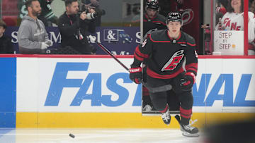 May 28, 2025; Raleigh, North Carolina, USA; Carolina Hurricanes defenseman Scott Morrow (56) enters the ice for warm up prior to the first period against the Florida Panthers in game five of the Eastern Conference Final of the 2025 Stanley Cup Playoffs at Lenovo Center. Mandatory Credit: James Guillory-Imagn Images